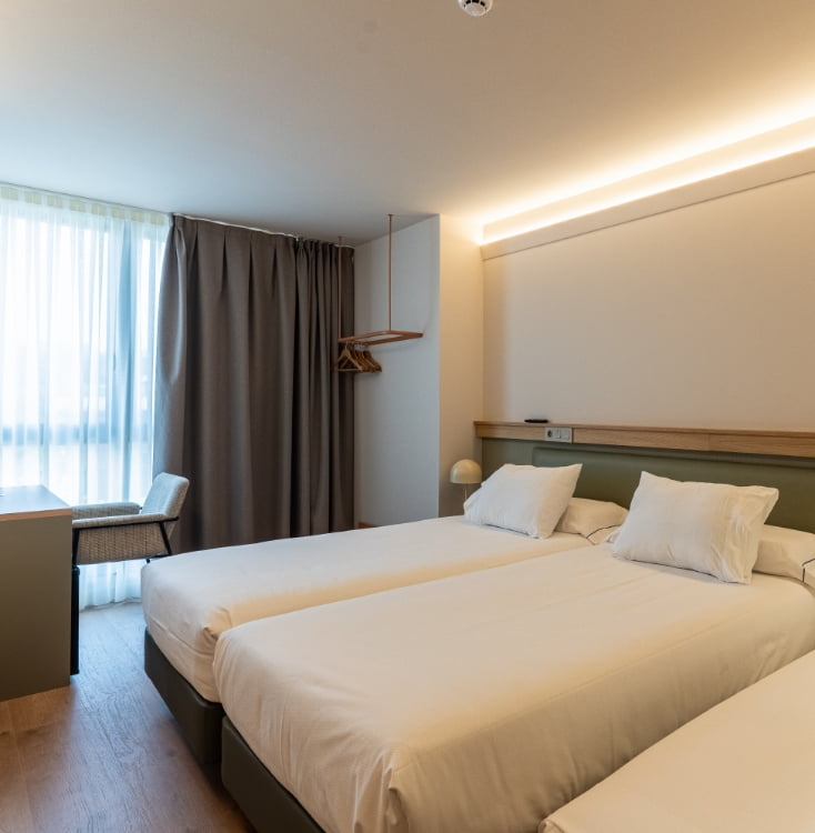 Superior double room Los Pasiegos Modern superior double room with king-size bed, desk and designer lamps