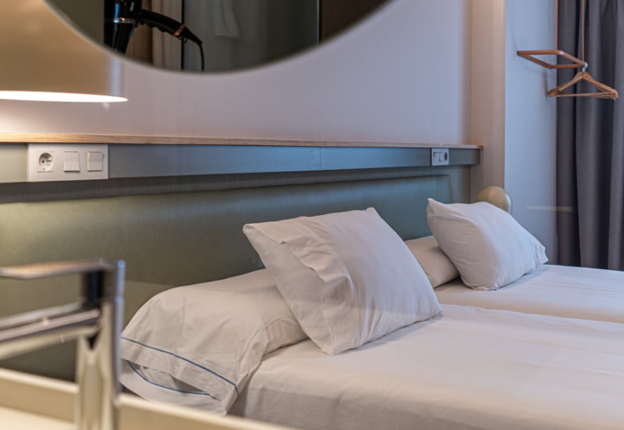 Double room detail of the headboard Double room with two separate beds