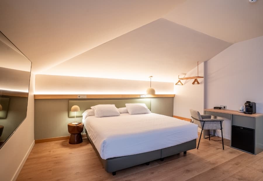 Superior triple room, general view Superior triple room with king-size bed, desk and amenities