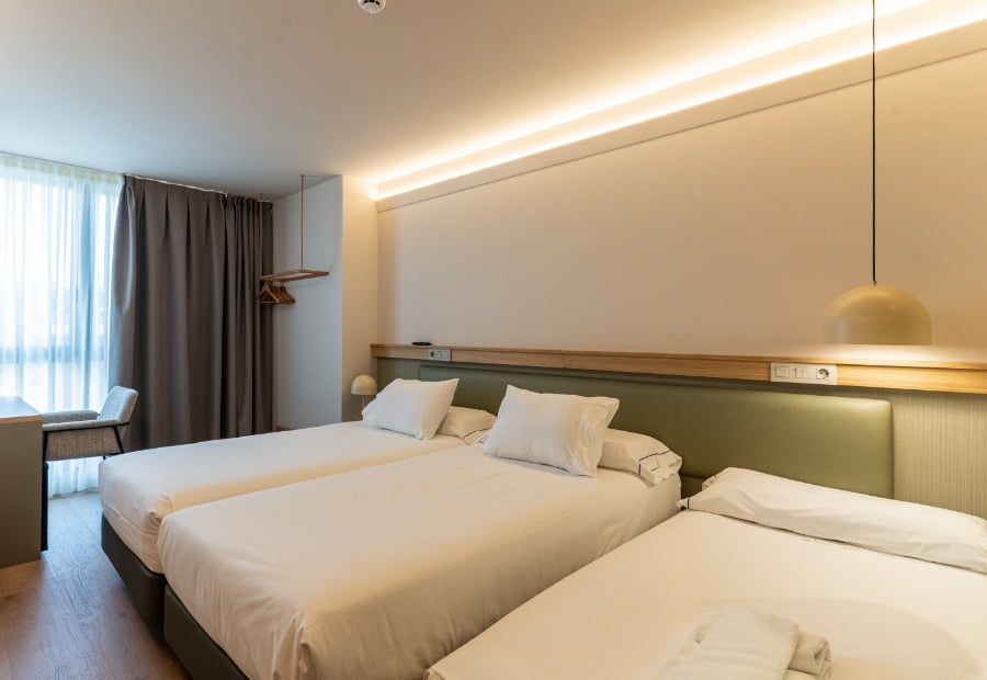 Triple room 1 Triple room with two beds and an extra bed