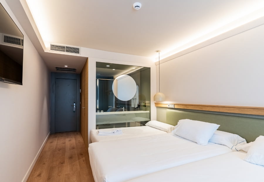 Triple Room 4 Triple room view of the beds and bathroom