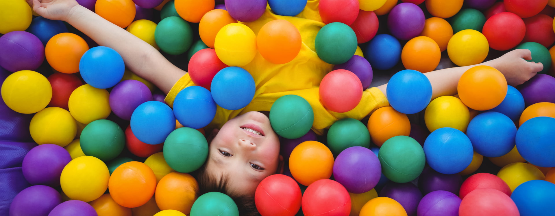 Villa Pasiega Picture of a child in a ball pool at the Los Pasiegos Group hotel.